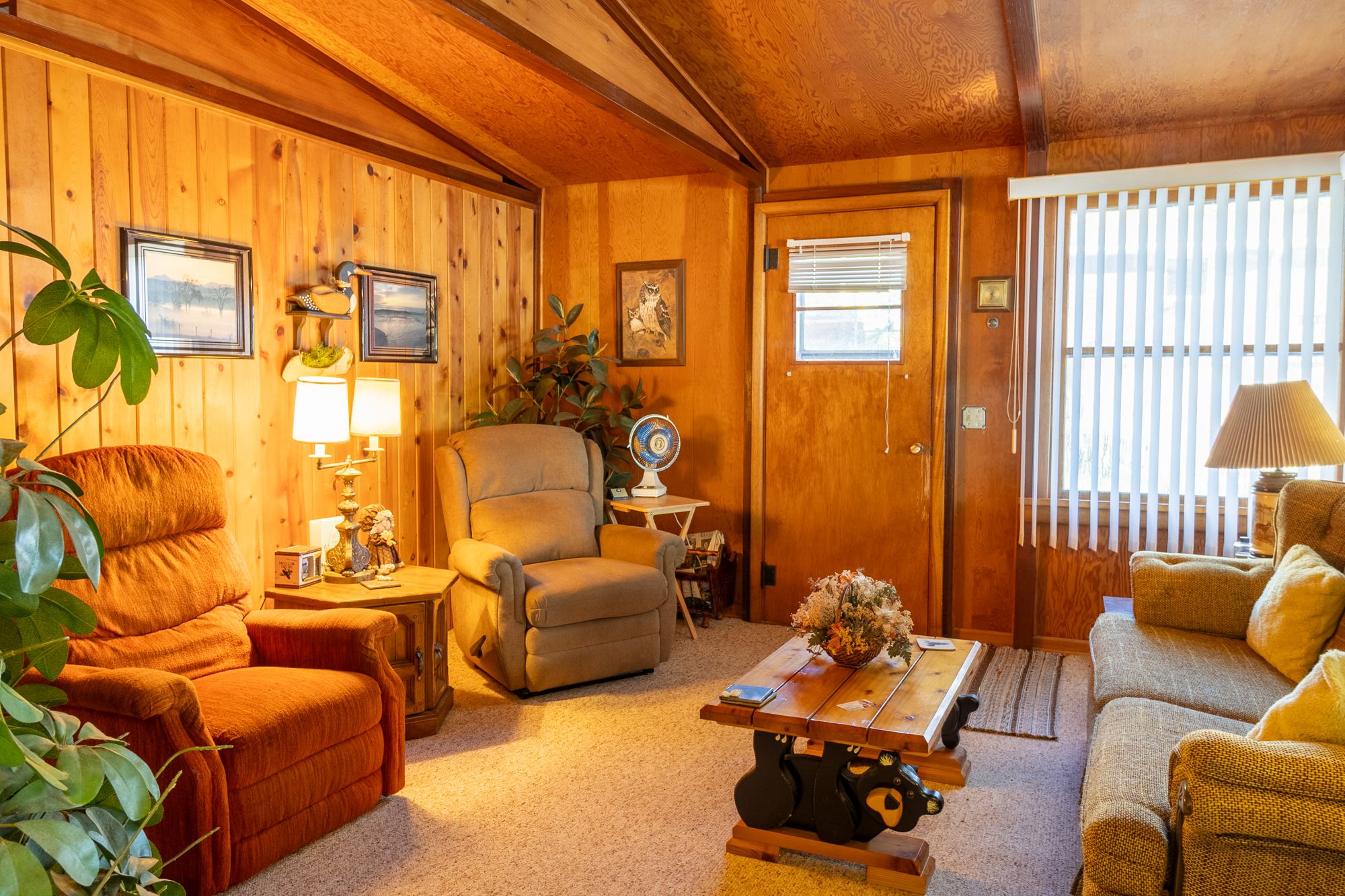 HDR photo of a knotty-pine cabin living room